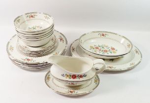 A Royal Doulton Kingswood dinner service comprising oval serving plate, two oval dishes, six pudding