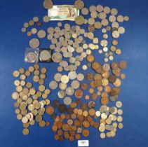 A miscellaneous tin of British and World coins including 25g silver content coins, 1946 three