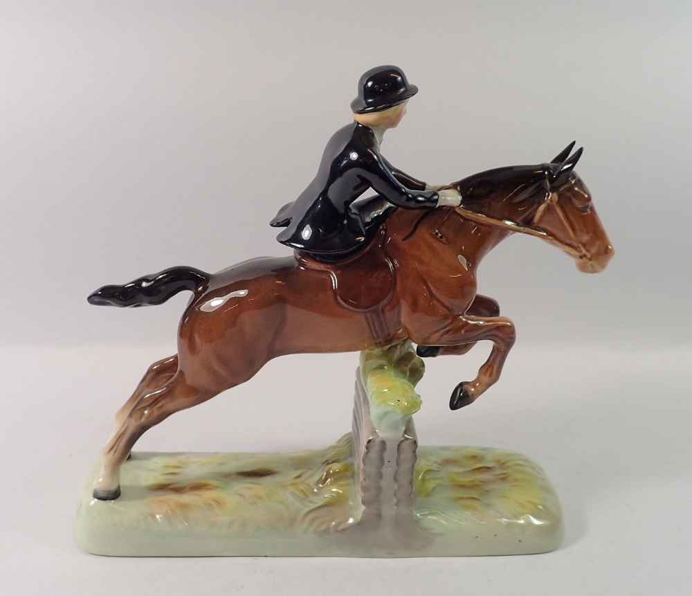 A Beswick huntswoman riding side saddle, taking a fence - Image 2 of 3