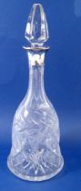 A cut glass claret decanter with silver collar