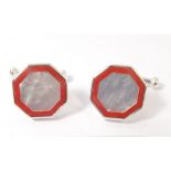 A pair of silver, red stone and mother of pearl cufflinks