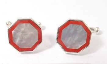 A pair of silver, red stone and mother of pearl cufflinks