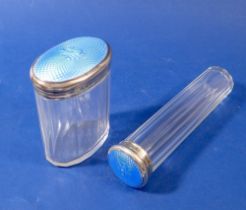 A cut glass toiletry jar and bottle with blue enamel lids, Birmingham 1926, by Adie Bros.