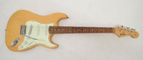 A Fender Stratocaster style electric guitar with wooden body, 98cm long