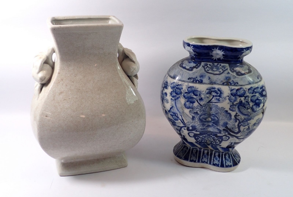 A Chinese blue and white large floral vase, 31cm tall and a crackle glaze one