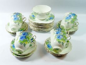 A Radfords floral set of eleven cups and saucers and twelve tea plates and sugar bowl