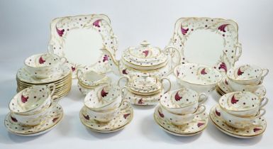 An early 19th century porcelain gilded and purple foliate tea service comprising teapot, milk,