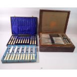 A silver plated set of eighteen dinner knives and two dessert knives and carving set, boxed plus two