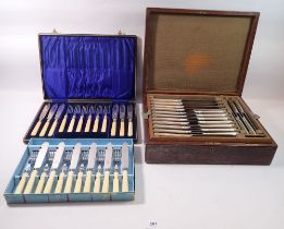 A silver plated set of eighteen dinner knives and two dessert knives and carving set, boxed plus two