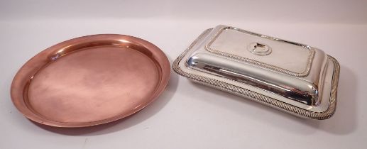 A copper circular tray and a silver plated entree dish