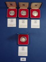 Four Elizabeth II 1977 Silver Jubilee crowns in sterling silver, each cased with COA, 28.276g each