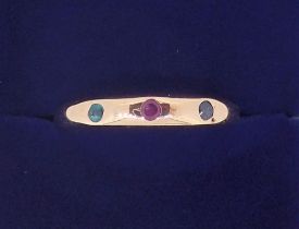 A gold plated ring set green, red, and blue stones, size Q