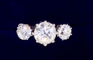 A fine quality platinum set three stone diamond ring, 2.5 cts in total, size M
