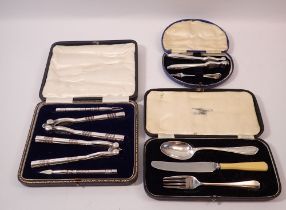 A pair of crab or lobster crackers and picks - cased, a single pair also cased and a matched