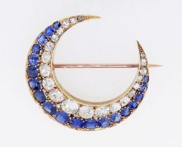 A fine 18 carat gold crescent moon brooch set graduated sapphires and diamonds, 3.8 x 3.6cm, the