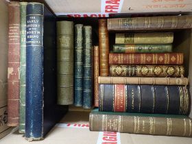 A box of antique books with leather bindings