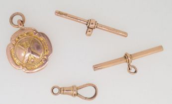 A 9 carat gold cricket bat and stumps medal and three 9 carat gold fob fittings, 9.5g