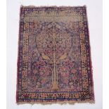 A Persian rug with bird in flowering tree design, 120 x 90cm