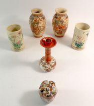 Two pairs of Japanese Satsuma vases and a Kutani box and candlestick, tallest 15.5cm