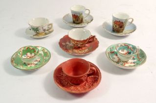 Seven various miniature cups and saucers