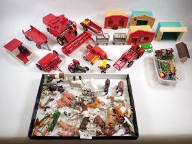 A group of Britains Ltd farmyard toys, vehicles and animals including a 1978 Massey-Ferguson combine