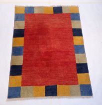A geometric coloured rug 186 x 142cm