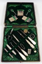 A Victorian mother of pearl needlework and manicure set - cased