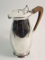 An Arts & Crafts silver coffee jug, Birmingham 1919 by A E Jones, total weight 448g 20cm tall