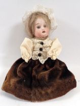 A Victorian bisque headed small doll with porcelain legs, 16cm