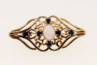 A 9 carat gold openwork brooch set opal and six sapphires, 4g, 4cm long