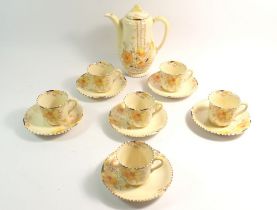 A Wilkinson's Art Deco Honeyglaze coffee set comprising coffee pot, six cups and saucers