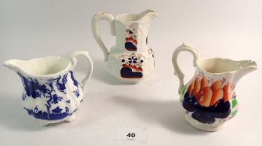 Two Gaudy Welsh jugs and a blue and white jug with pseudo oriental marks, tallest 12.5cm