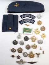 An interesting collection of Royal Air Force and Royal Flying Corps insignia, cap/collar badges,