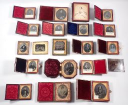 A box of Victorian daguerreotypes in leather cases plus one in early pressed plastic case