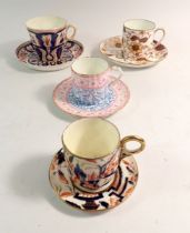 A 19th century Wedgwood coffee can and saucer and three others including one decorated seaweed