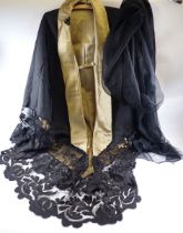 A Victorian black silk cape with silk lining and deep lace trim and a chiffon and silk large stole