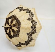 A Victorian cream silk and black lace parasol, 96cm long