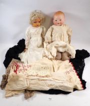 An Armand Marseille bisque head doll 351.14 and a Kammer & Reinhardt German early plastic doll