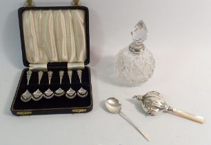 A set of six silver coffee spoons, Birmingham 1956 - cased, 46g plus a silver rattle and spoon,