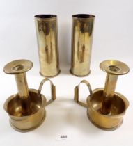 A pair of brass trench art candlesticks, 17cm tall and a pair of shell case vases