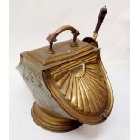 A Victorian brass coal scuttle with embossed sunray decoration