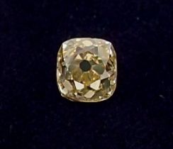 An unmounted cushion cut yellow diamond, approx diamond weight 0.77ct