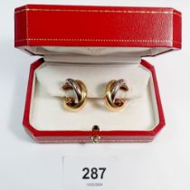 A pair of Cartier Trinity three-colour 18 carat gold earrings No D07589, signed, Cartier box, 15.
