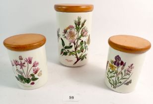 A set of Three Portmeirion storage jars with wooden lids, 1 x 18cm high, 2 x 12cm high