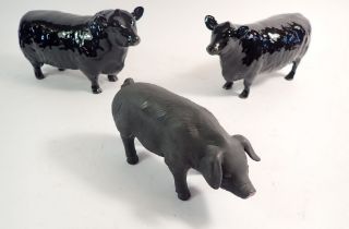 A Beswick Aberdeen Angus black gloss bull and cow plus a black bisque pig