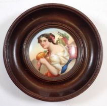 A 19th century painting on porcelain miniature of an Italian woman with vines, 6.5cm diameter