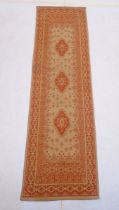 A vintage Abbusson style red and cream runner