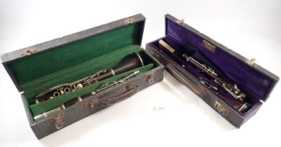 An antique rosewood oboe stamped 'JTL' and a student clarinet - both cased