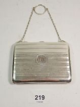 A silver purse with pencil and pigskin fitted interior, Birmingham 1912, total weight 110g 10.5cm