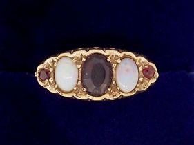 A vintage 9 carat gold garnet and opal ring, Birmingham 1978, 3.4g, size O-P